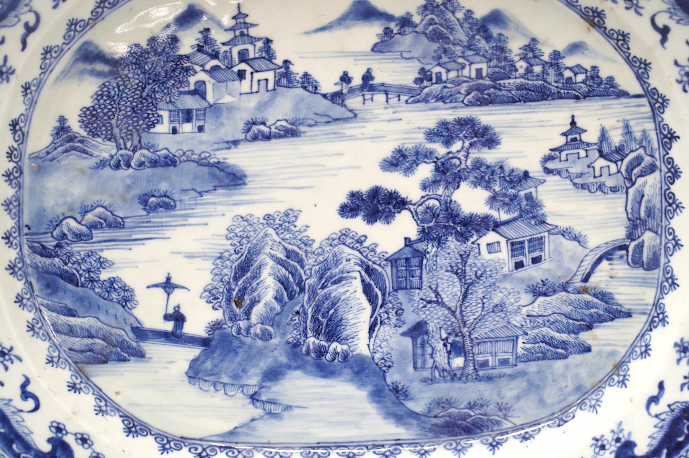 An 18th century Chinese octagonal export blue and white dish, 41cm wide. Condition - fair